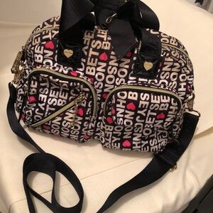 Betsey Johnson Small Black and Pink Bag. Guitar Strap and handles. Callout